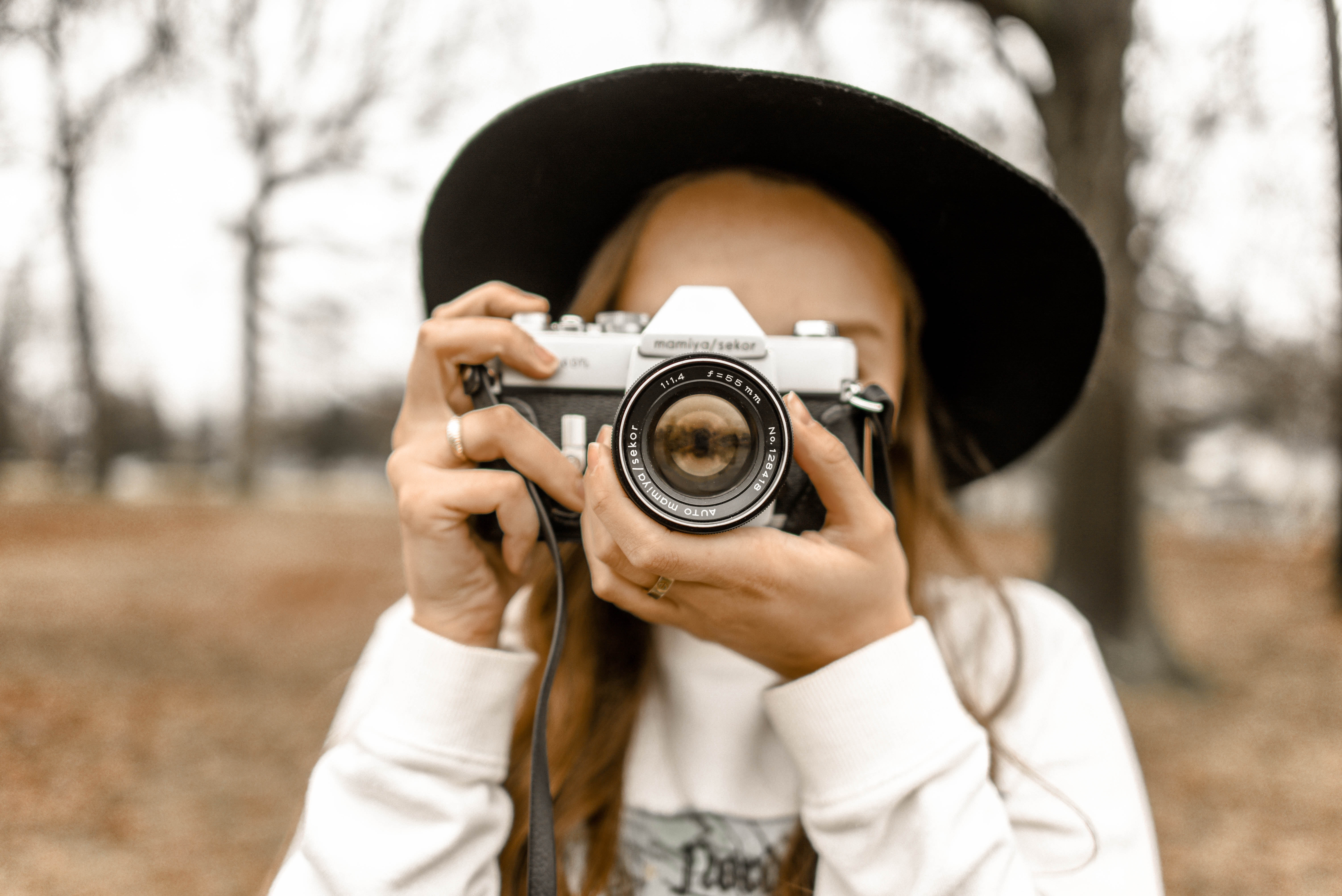 Girl holding up camera and taking picture