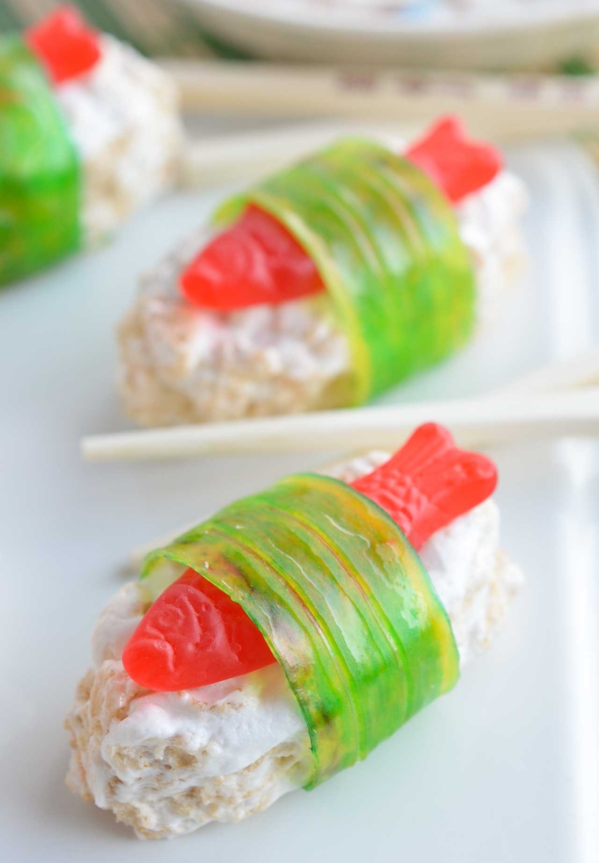 rice crispy treat and swedish fish wrapped with fruit roll up